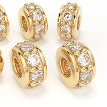 Load image into Gallery viewer, 18k solid yellow gold wheel beads, 5mm in size, featuring a 0.10ct natural diamond in a prong setting. These beads are designed for jewelry making, ideal as spacers or decorative accents on necklaces and bracelets for a luxurious and sparkling touch