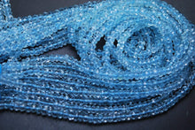 Load image into Gallery viewer, 1/2 Strand, Super Finest Quality Sky Blue Topaz Faceted Rondelles Size 4mm - Jalvi &amp; Co.