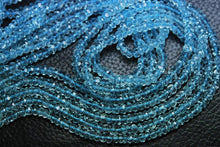 Load image into Gallery viewer, 1/2 Strand, Super Finest Quality Sky Blue Topaz Faceted Rondelles Size 4mm - Jalvi &amp; Co.