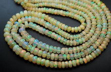 Load image into Gallery viewer, 14 Inch Strand, 54 Carats,Ethiopian Opal Faceted Rondelles, 4-7mm Size - Jalvi &amp; Co.