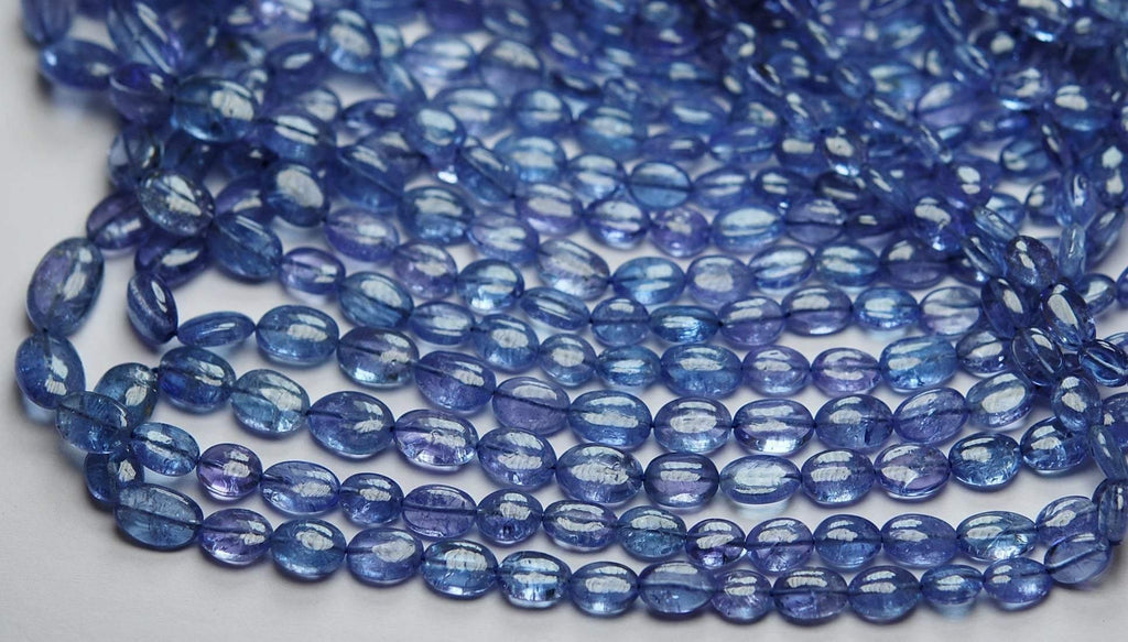 16 Inch Strand, Finest Quality, Natural Tanzanite Smooth Oval Nuggets, 5-7mm Size - Jalvi & Co.