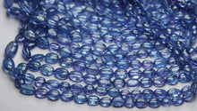 Load image into Gallery viewer, 16 Inch Strand, Finest Quality, Natural Tanzanite Smooth Oval Nuggets, 5-7mm Size - Jalvi &amp; Co.