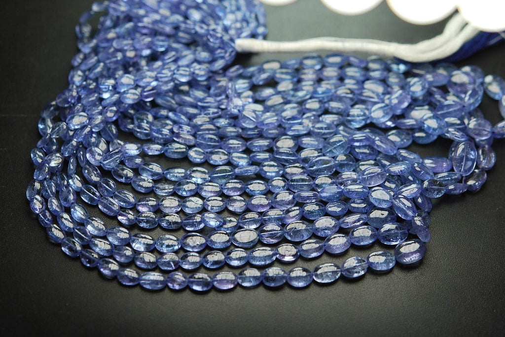 16 Inch Strand, Finest Quality, Natural Tanzanite Smooth Oval Nuggets, 5-7mm Size - Jalvi & Co.