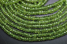 Load image into Gallery viewer, 4X13.5 Inches Strand, Aaa Super Rare Peridot Faceted Rondelles Large Size 4mm - Jalvi &amp; Co.